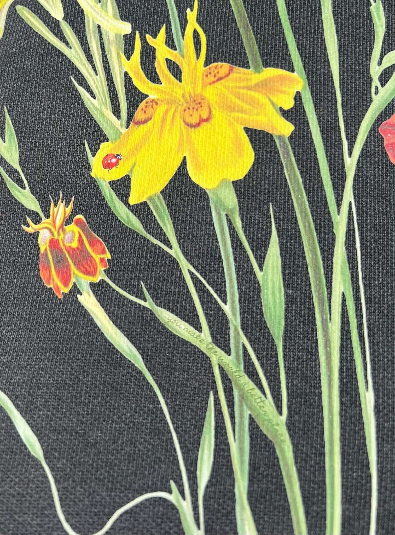 Close up of Gray sweatshirt with wildflower bloom