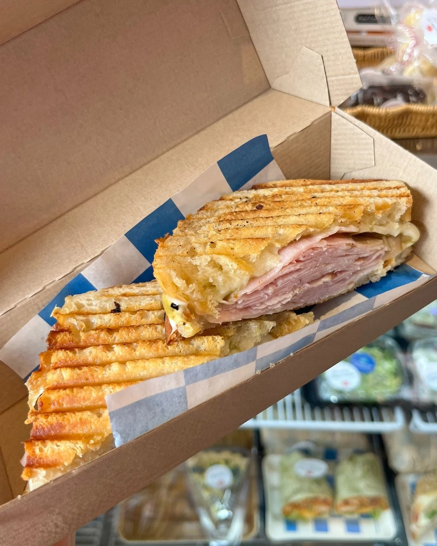 It&rsquo;s beginning to look a lot like Friday at the MARKET! 💙  Grilled Ham &amp; Havarti featuring a local fave @davinaraeshotsauce, Caesar Salads, and our Buffalo Cauliflower Wrap. Come say hi today! 

Only FOUR more days to shop GINGHAM this yea