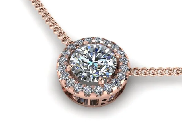 Close-up of a rose gold necklace with a round solitary diamond pendant surrounded by smaller diamonds.