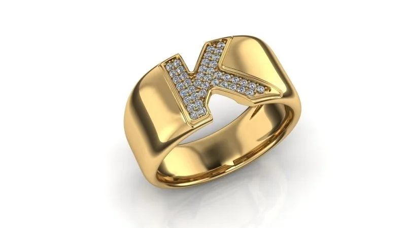 Gold ring with a letter K encrusted with small diamonds.