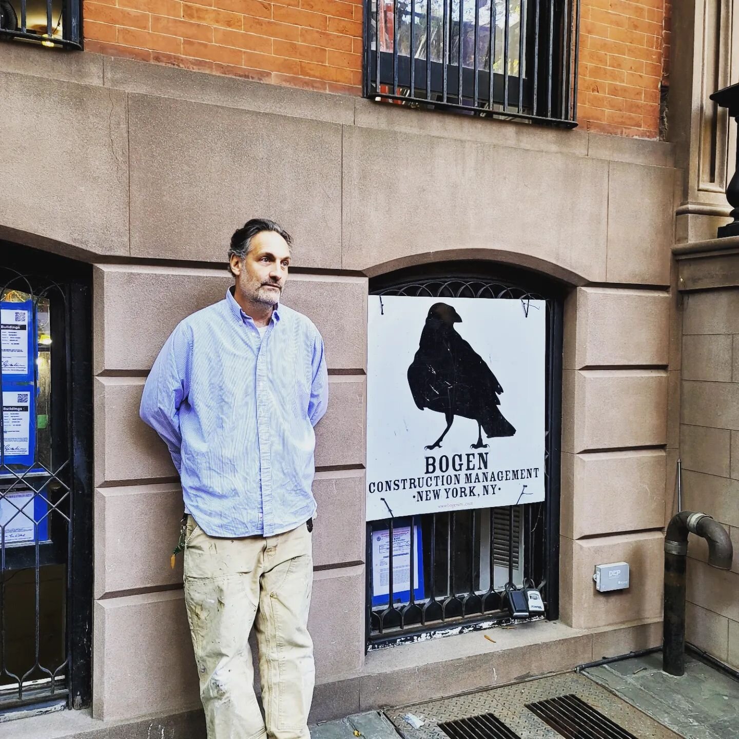 A casual shot of a man and his sign. @bogen_inc .. thank you.  Amazing team, amazing creativity. #teamwork #architecturedesign #westvillage #ownersrepresentative #constructionmanagement #ifyoubuildittheywillcome #townhouses #restoration