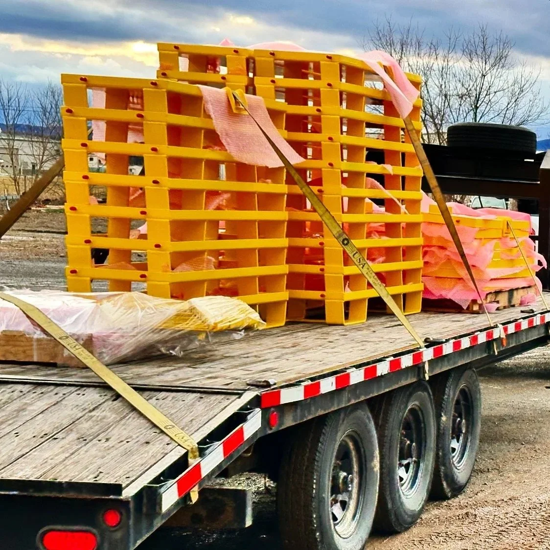 Trailer load of powder coated production parts finished by ADK Blast N Coat