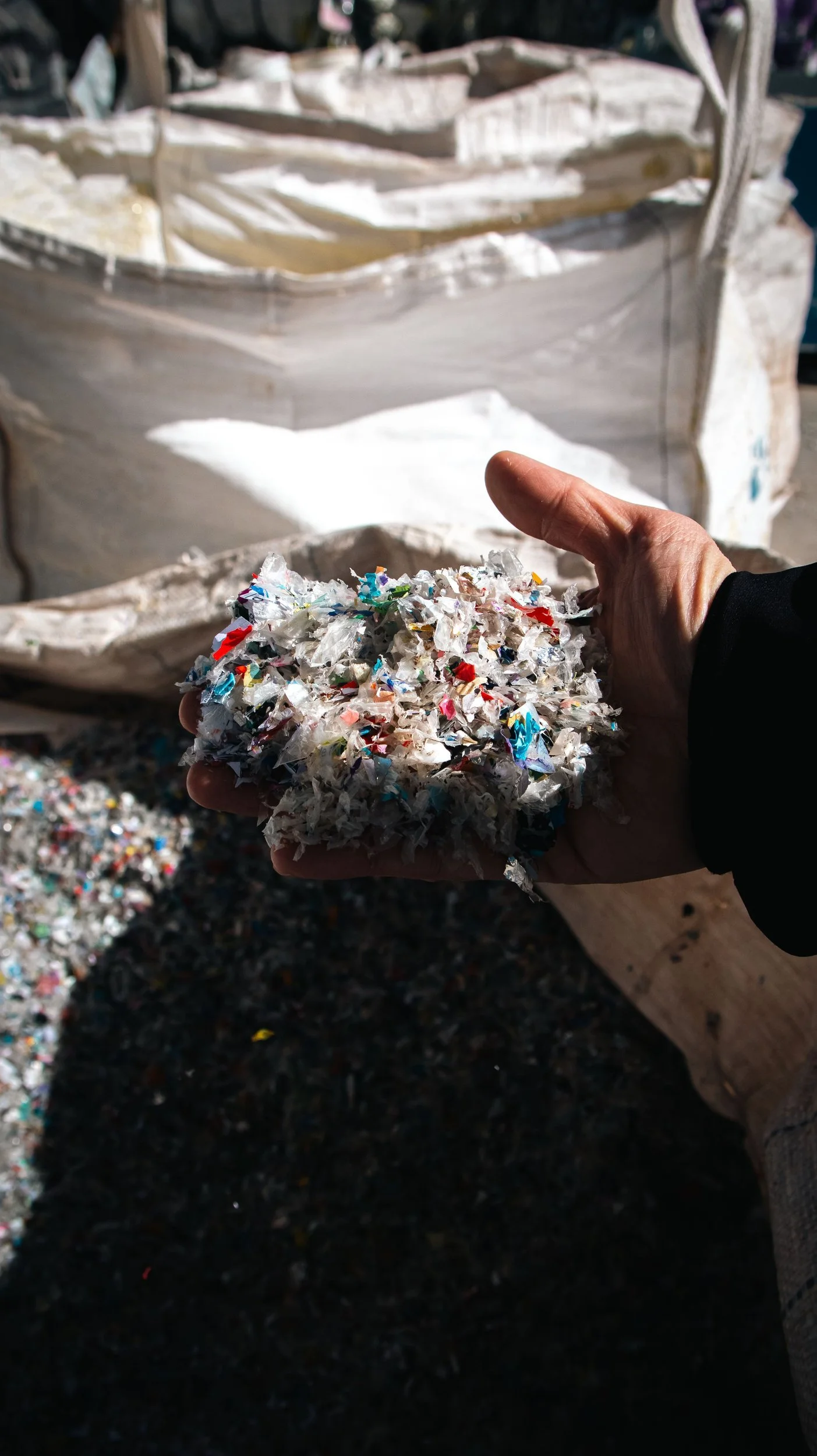 Shredded recycled material being sorted by hand