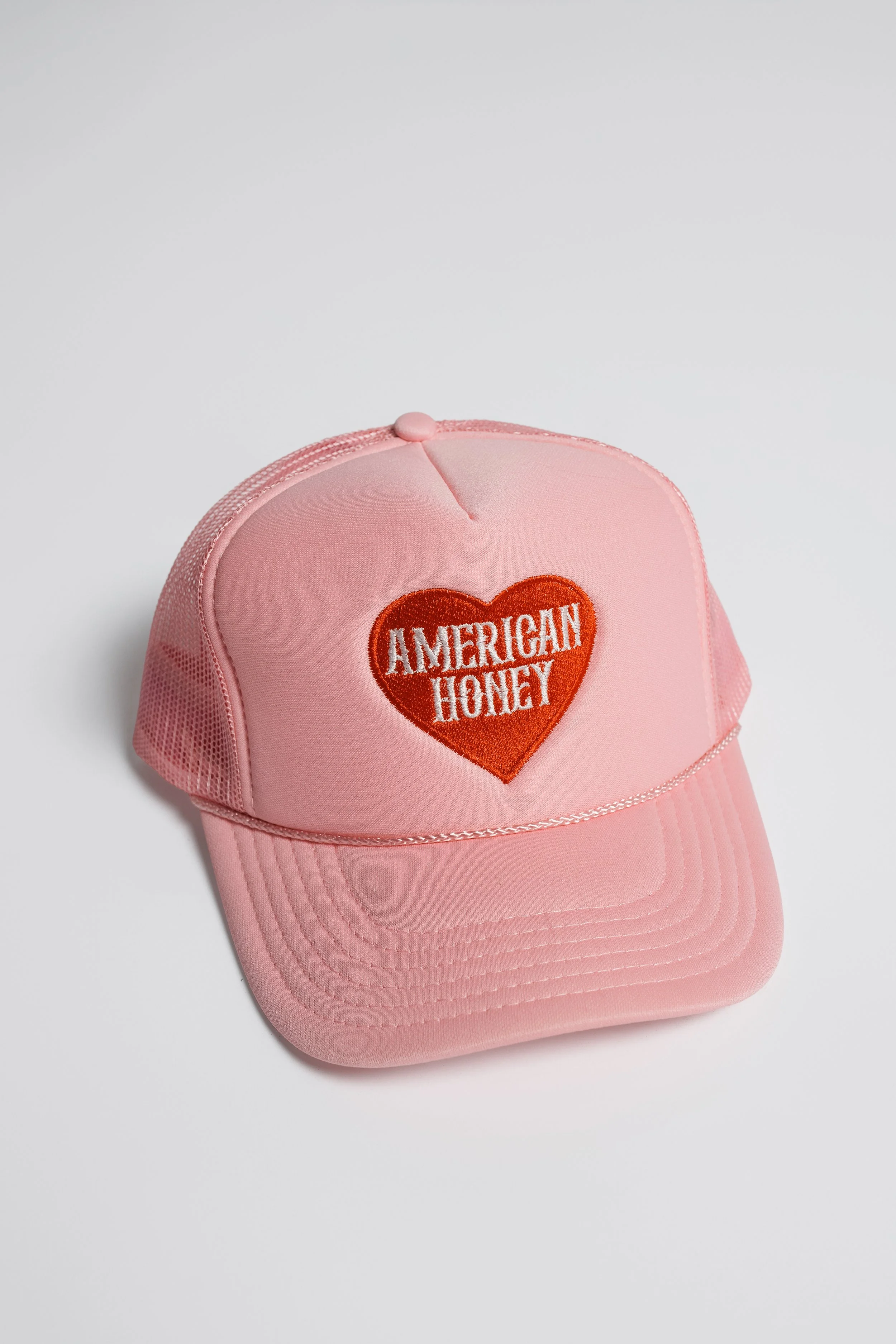 Pink hat with pink or red heart