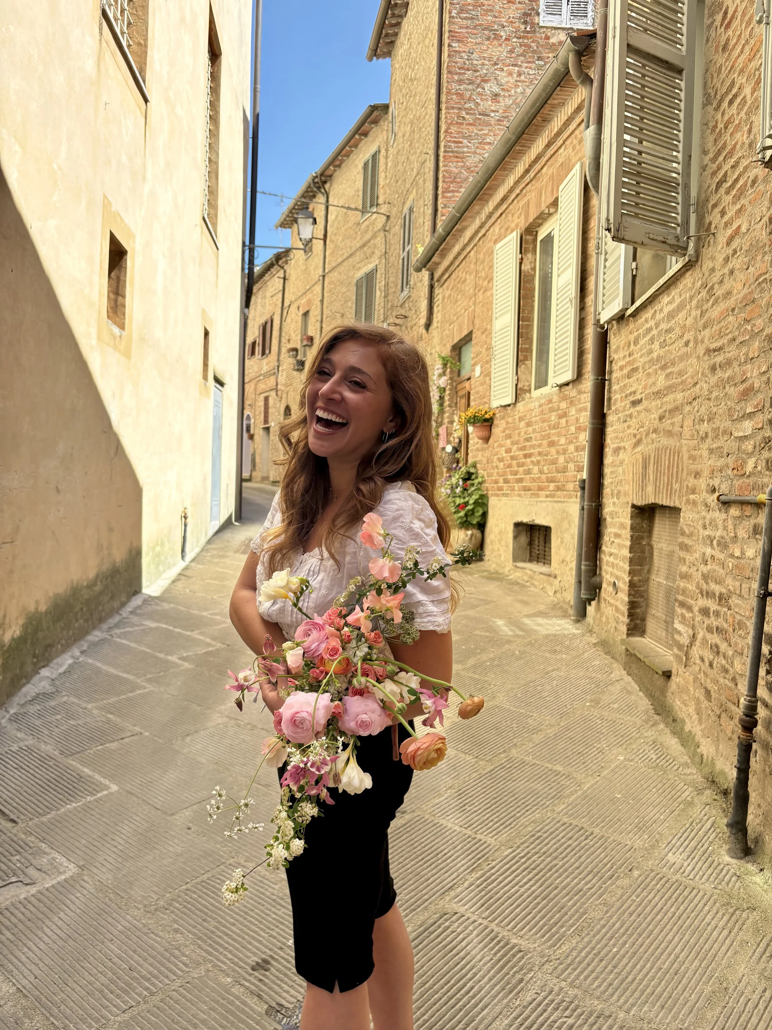 Saturdays in the Sun founder Samantha Hertz creating a custom floral arrangement