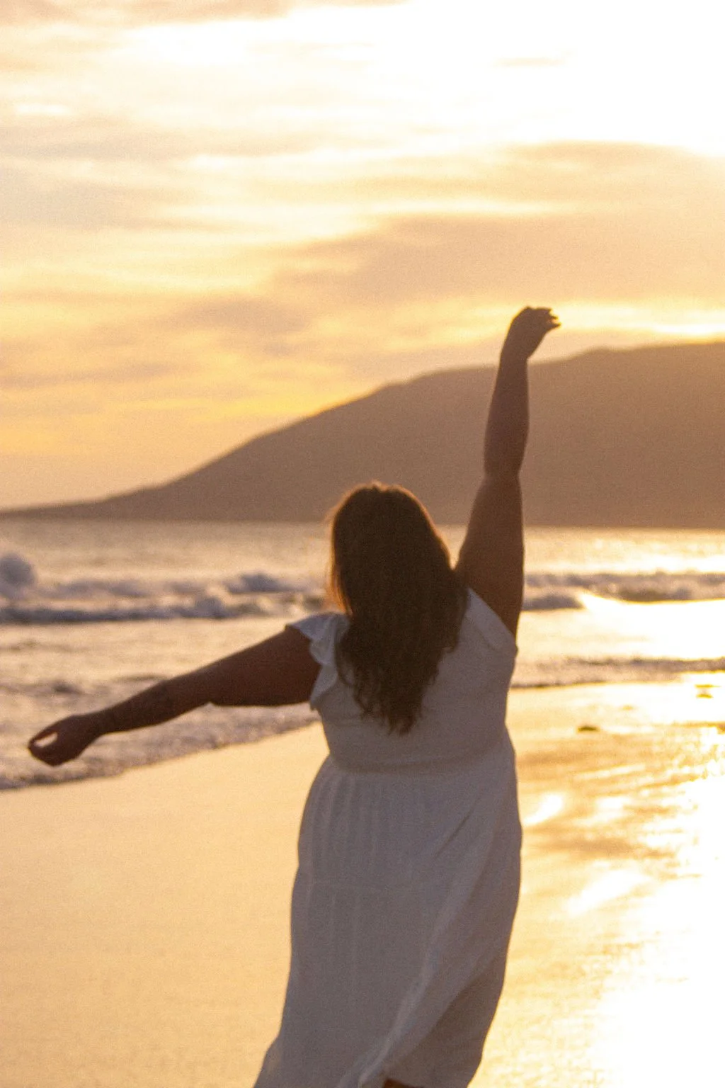 codependency counselor ann standing on the beach at sunset getting ready for her next online therapy session