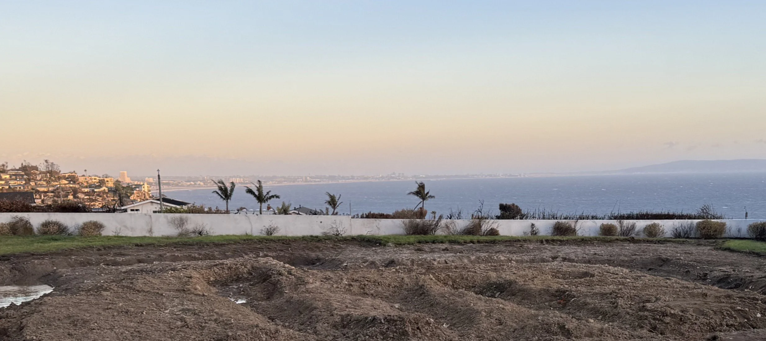Site work clearing debris by fire at the Palisades Residence, photograph by Rob Michel