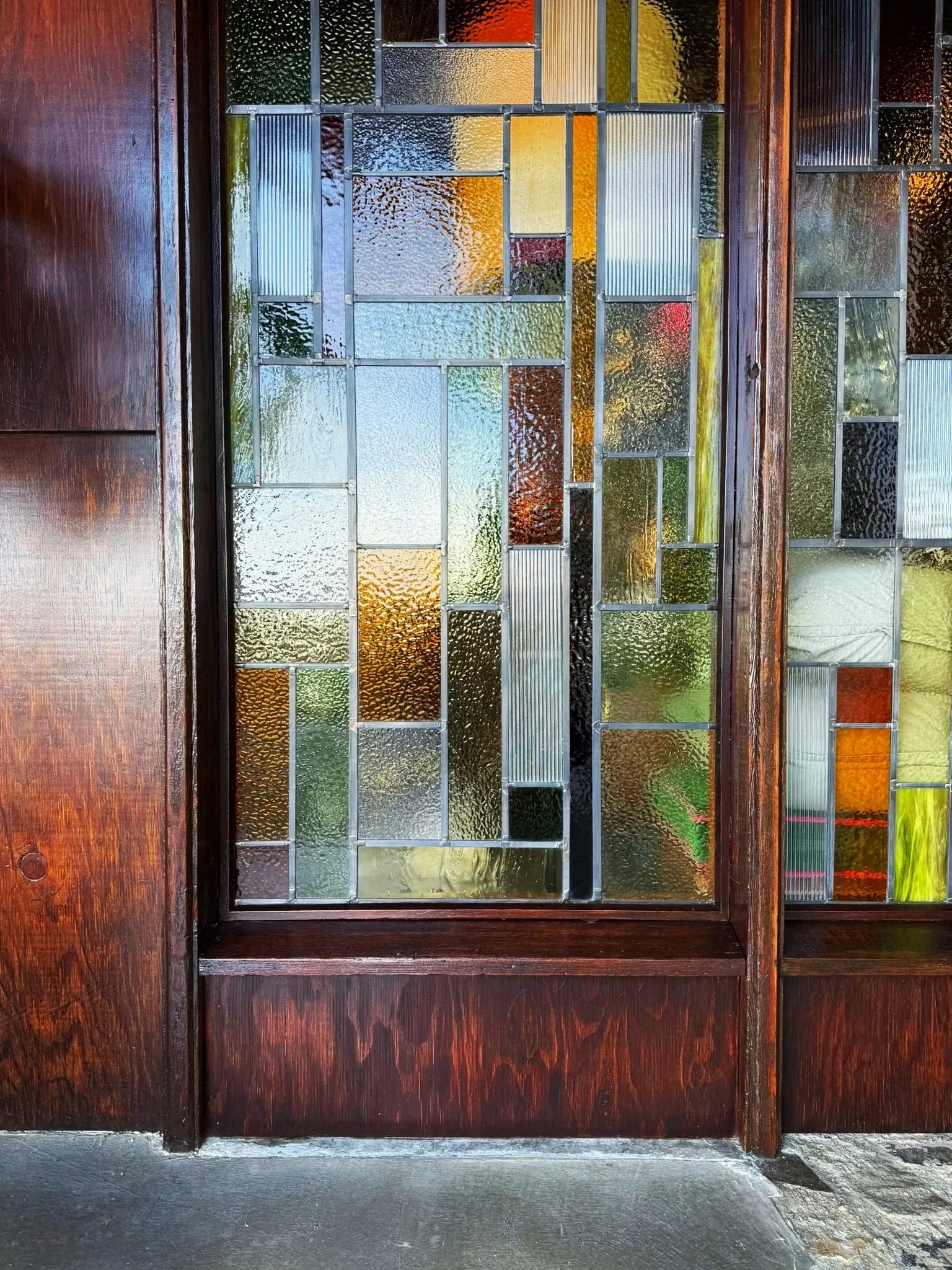 Front elevation of the new stained glass design at the Lloyd Wright Jr. original the De Jonghe Residence, designed by Michel Architects