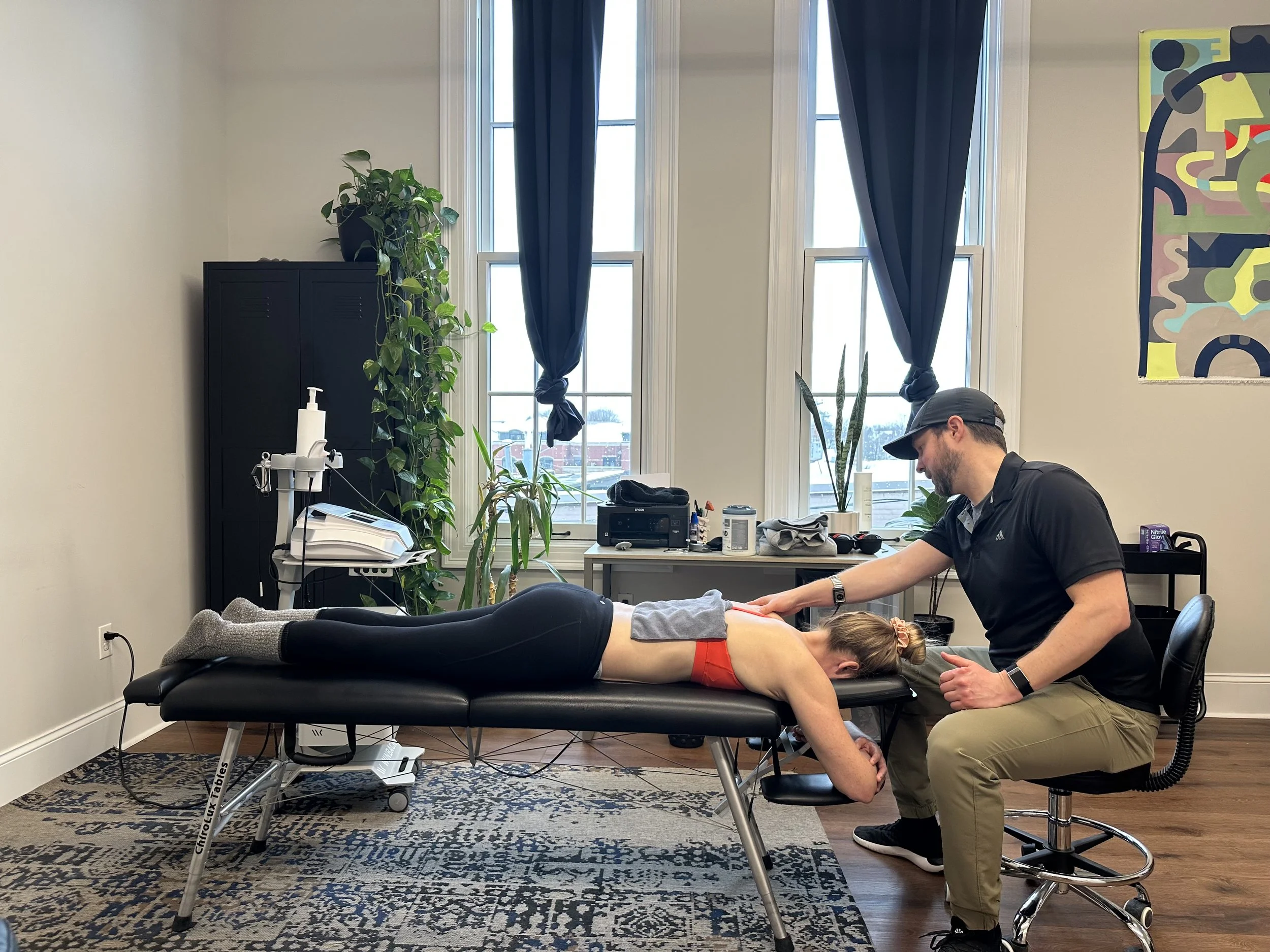 Guided therapy session for active adult addressing hamstring tightness through root-cause movement analysis in Saratoga Springs
