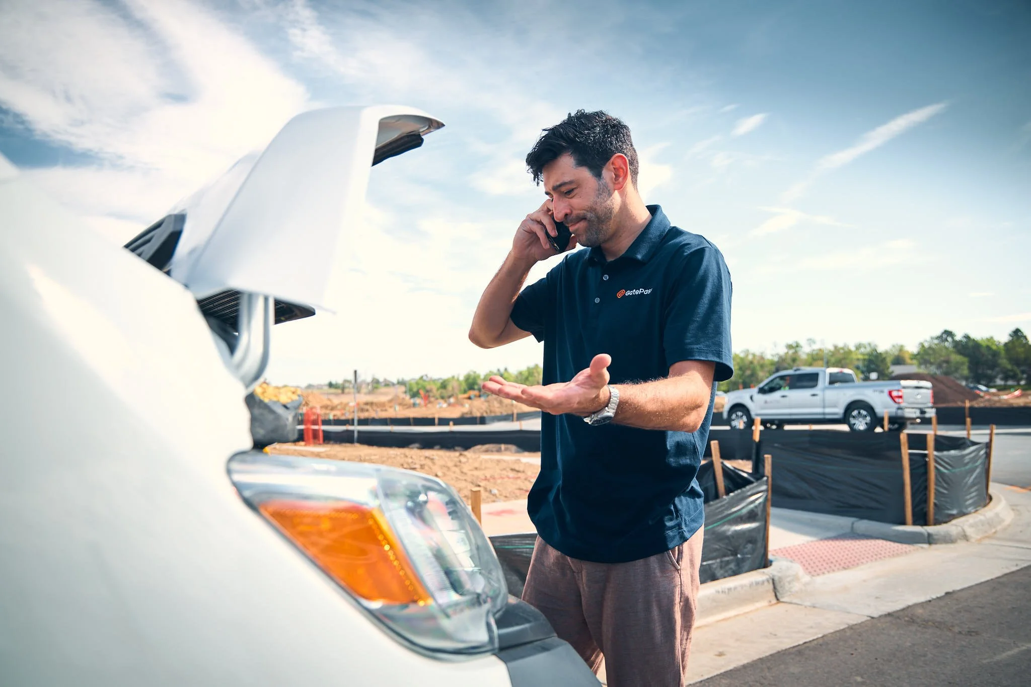 photo of a man on the phone with his van just broken down