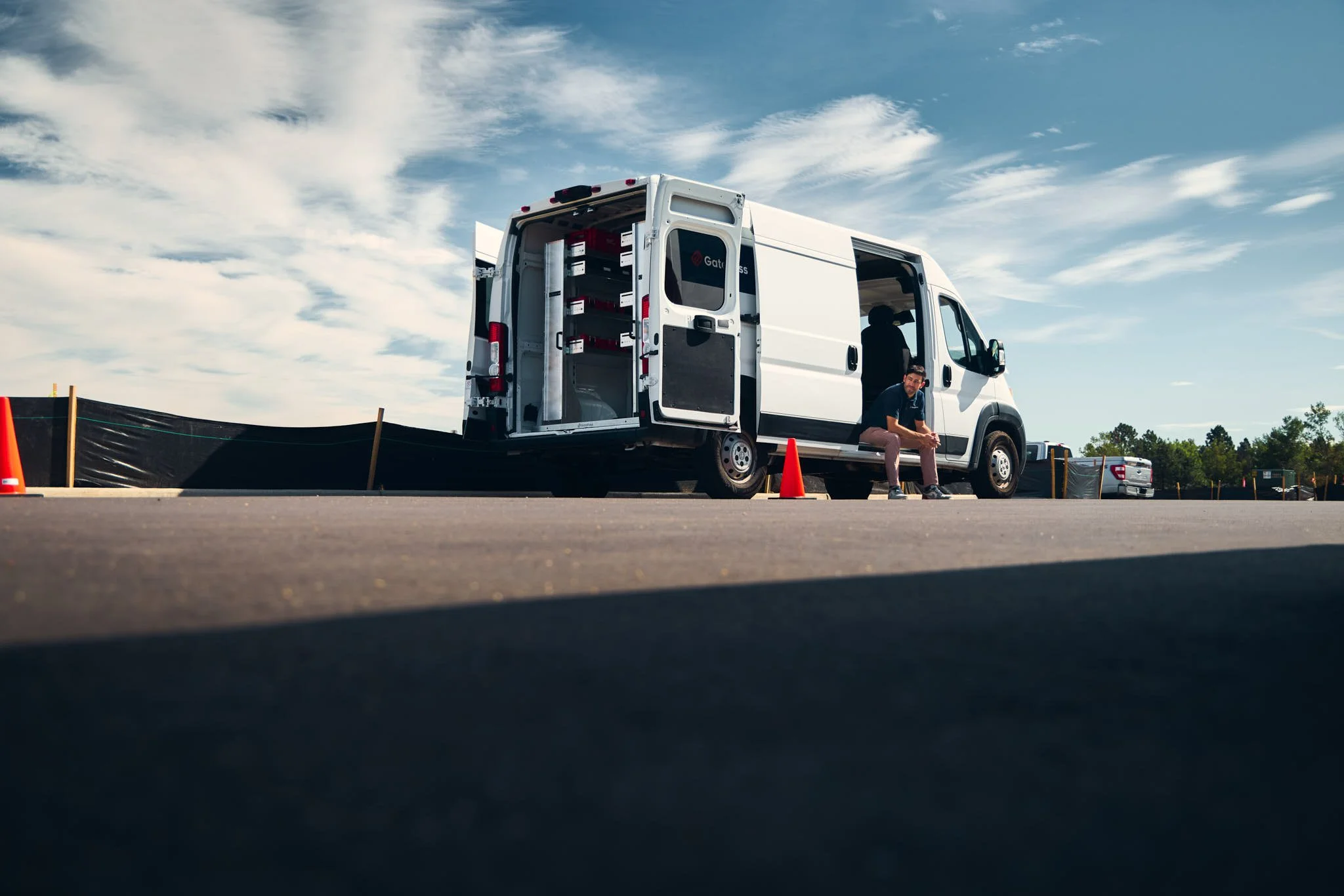 photo of a white trades worker van with all the doors open
