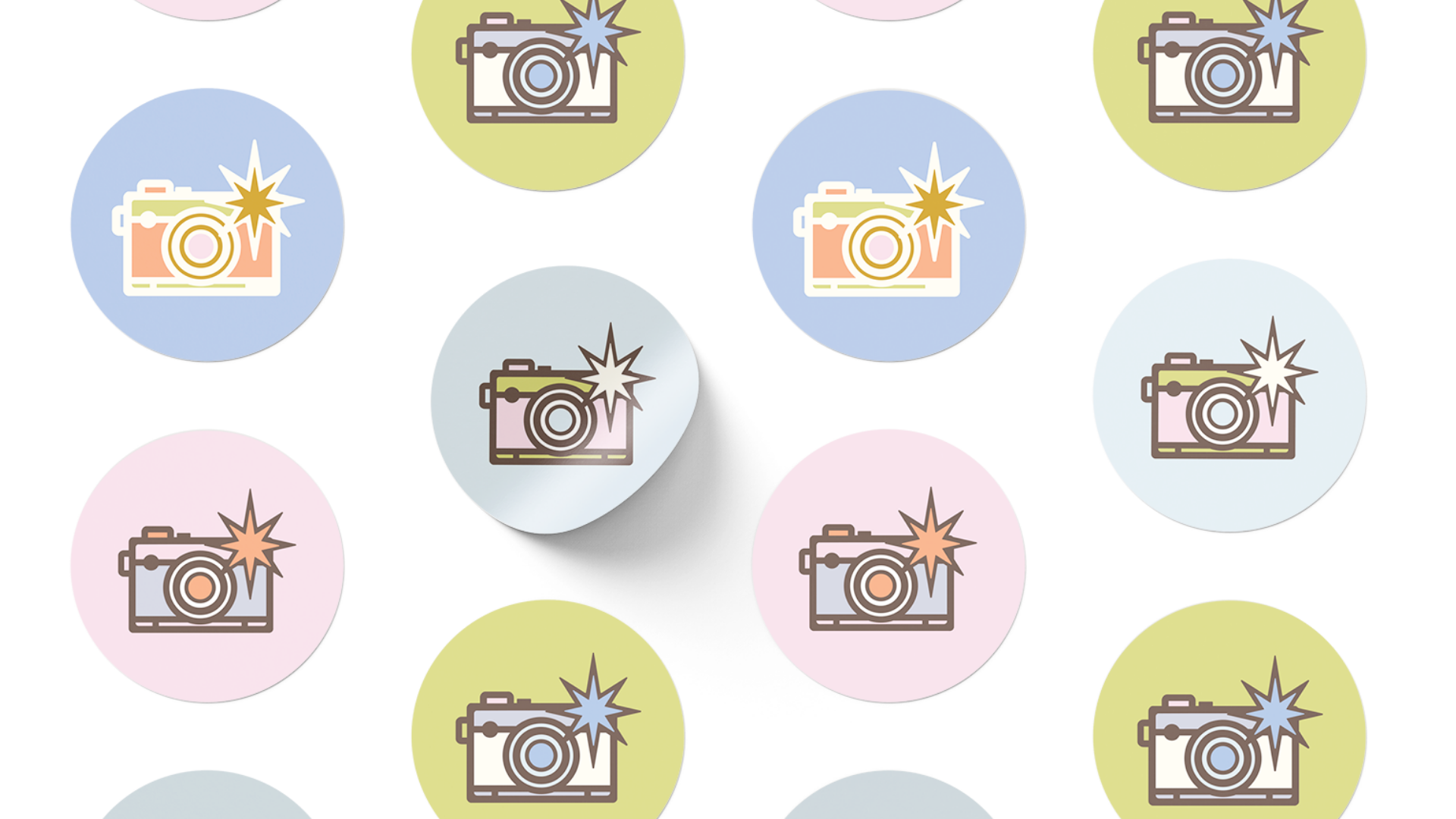 Pattern of graphic icons of cameras with a flash in pastel colored circles, alternating colors of blue, pink, green, and yellow.