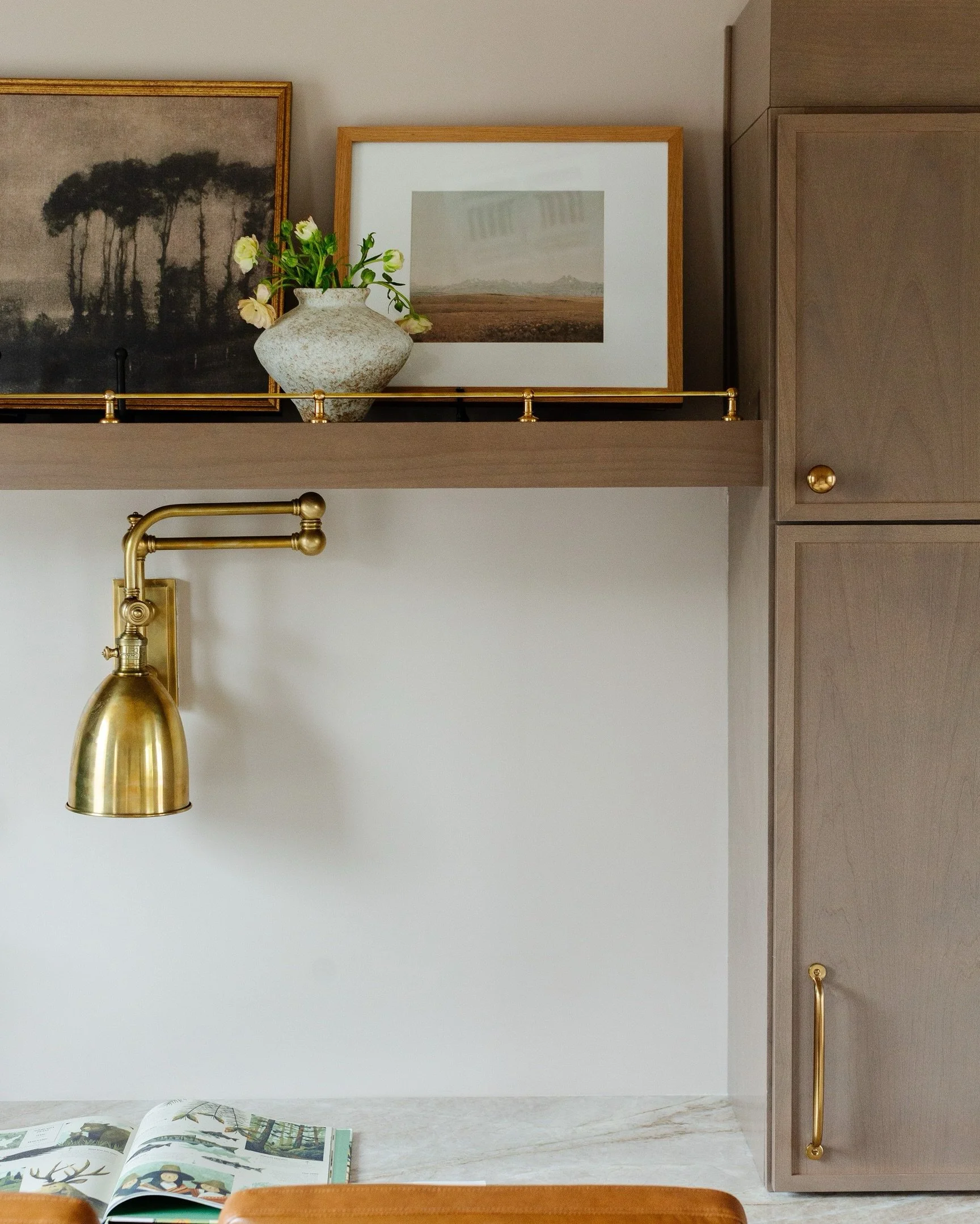 If this is what a home office looks like, sign us up for the 9-5! Warm stained mini shaker cabinetry with a natural stone desktop for two, antique brass lighting, and leather chairs that mean business at #LGDQuiteTheCharmer. 

Styling &amp; Furnishin