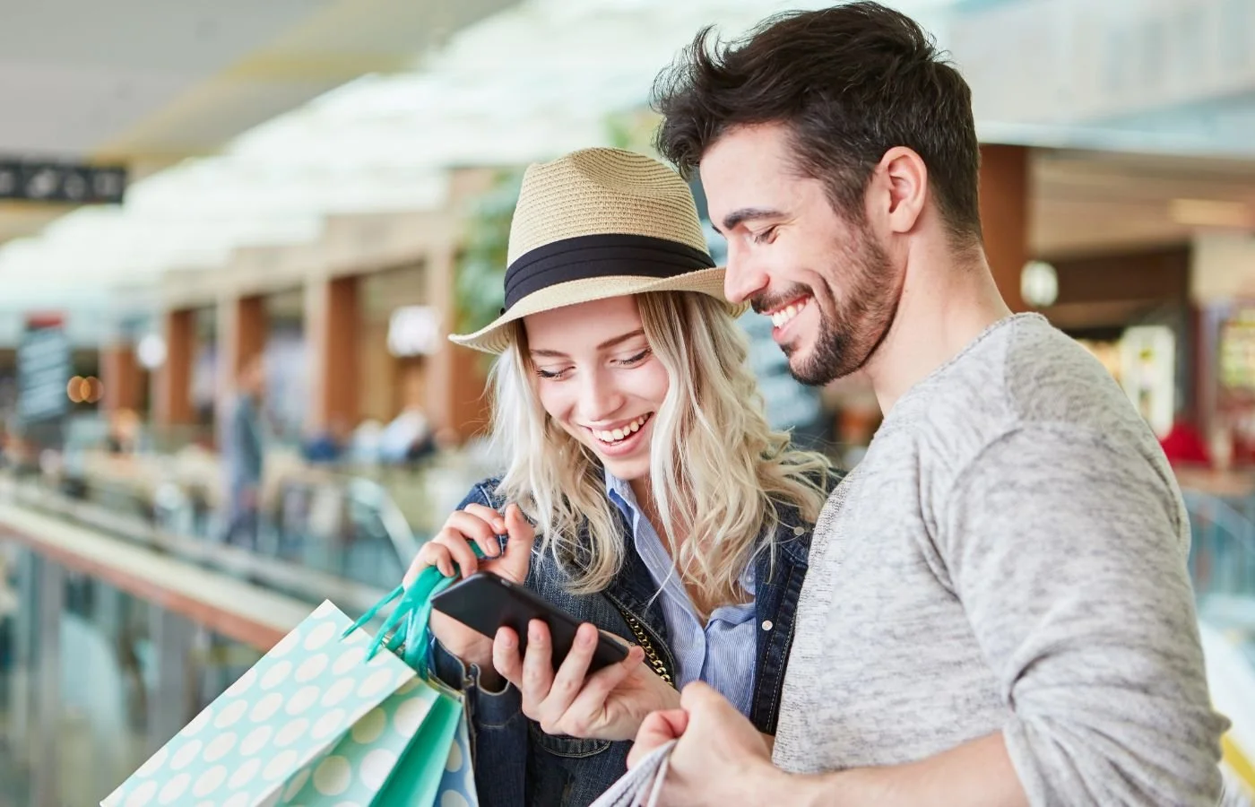 Smiling couple shopping together