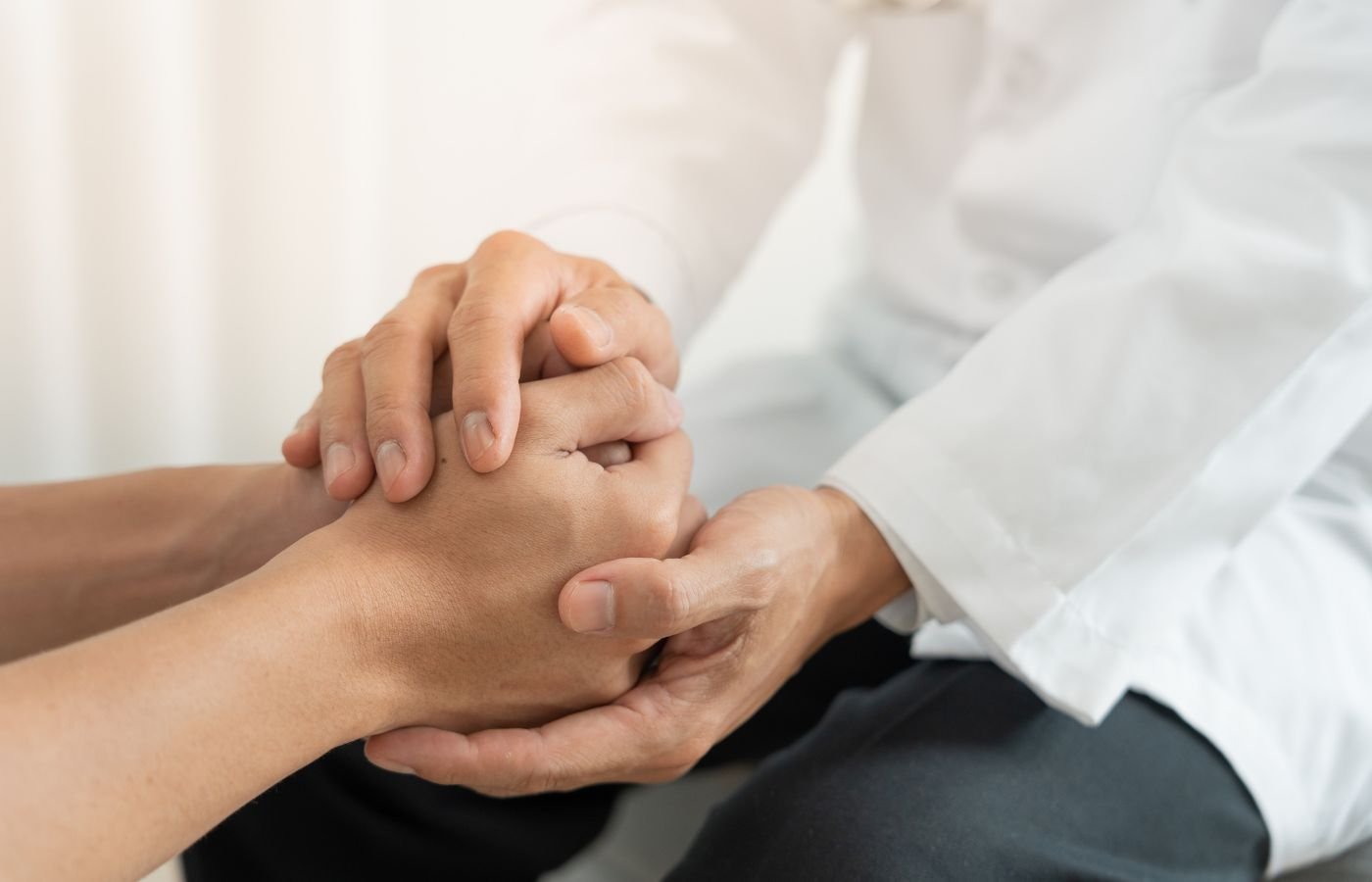 Hands holding, showing emotional support