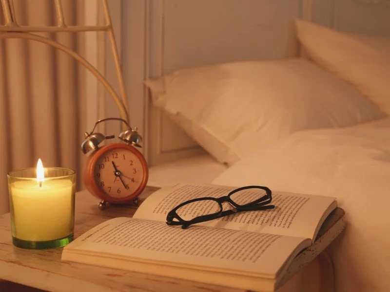 Book and Glasses Next to Bed