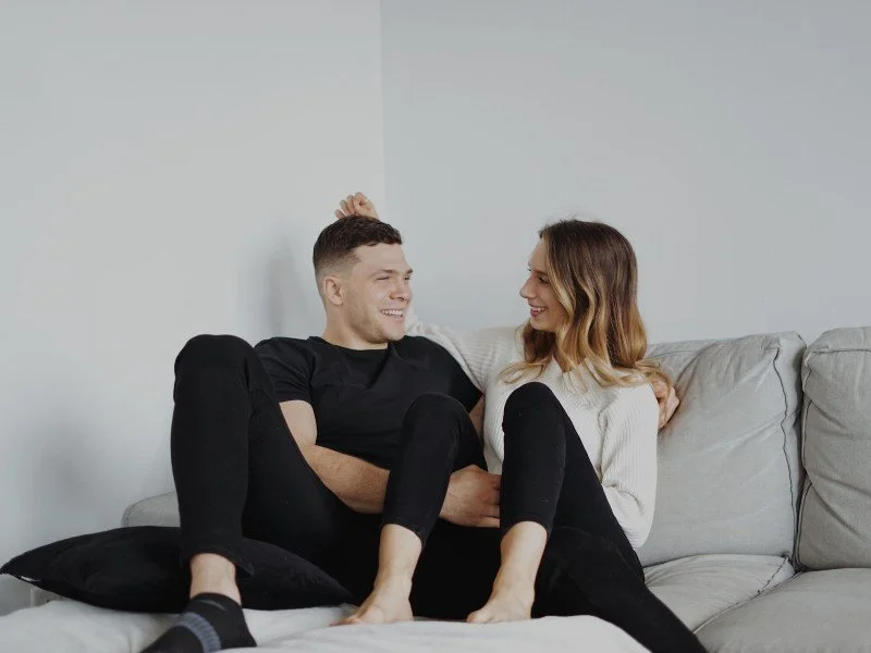 Couple Relaxing Together in Organized Space
