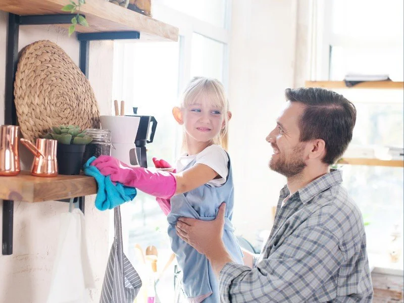 Father Helps Child Learn to Declutter