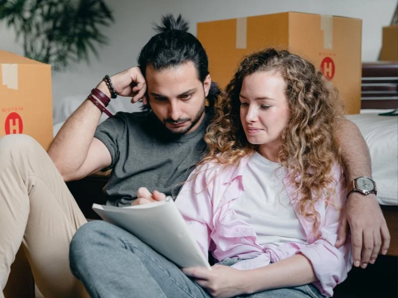Couple reviewing documents in moving process