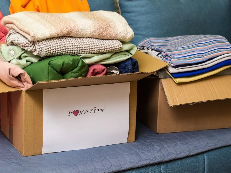 Donation box filled with clothes.