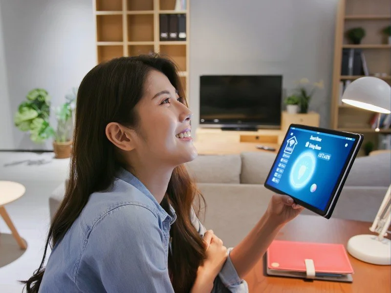 Controlling home devices with smart tablet.
