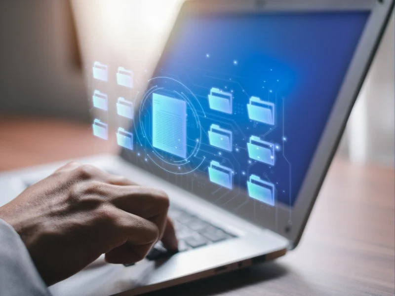 Navigating virtual files on laptop.