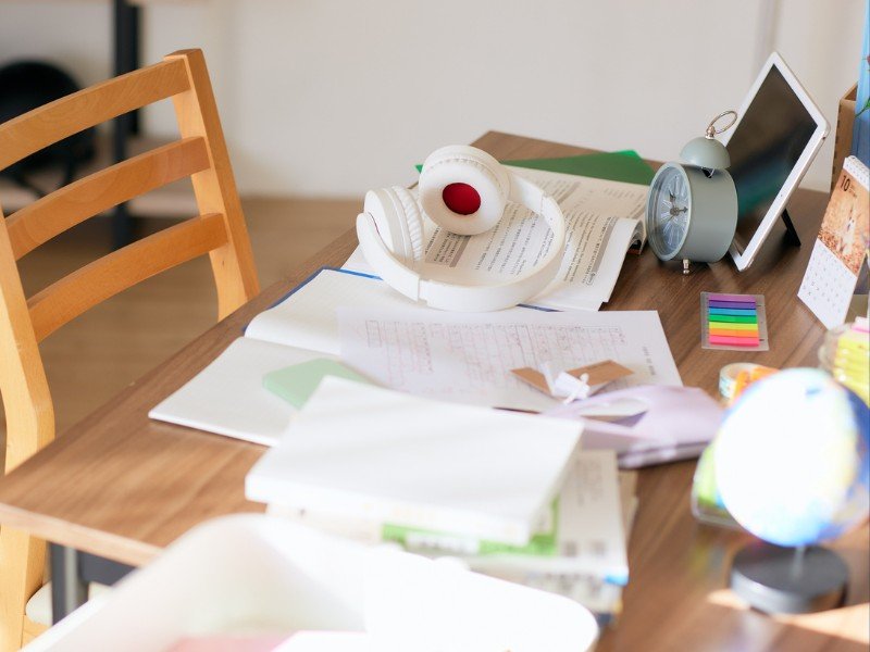 Messy desk with study materials.