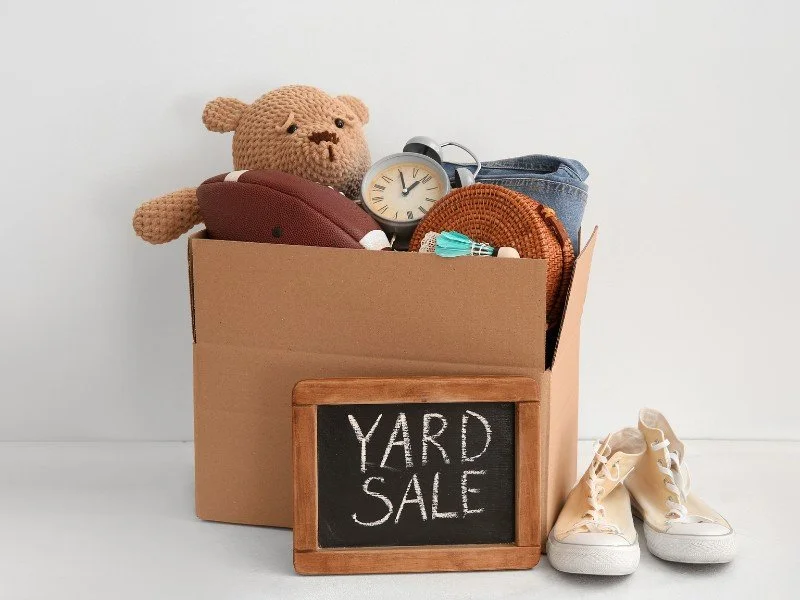 Yard sale box with toys and household items. (Copy) (Copy)