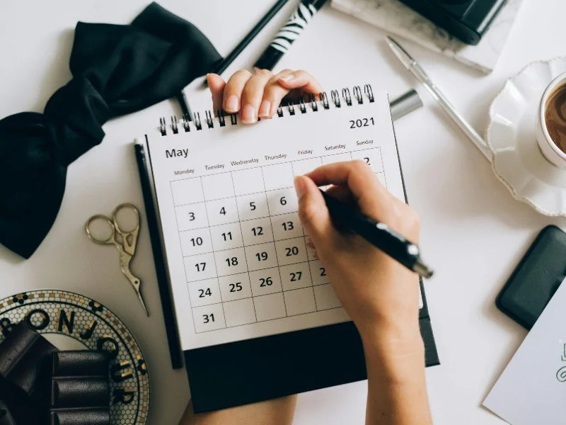 Marking dates on a calendar.