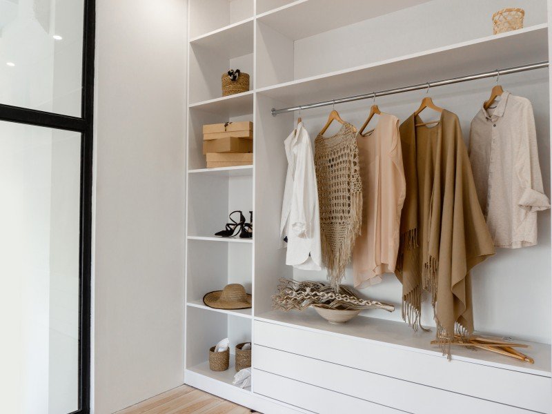 Spacious closet with shelves and hangers.