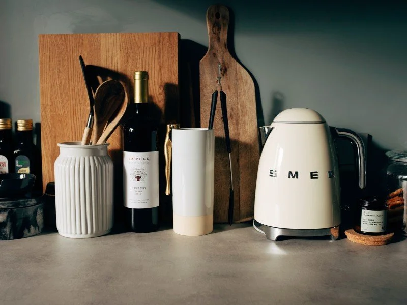 Modern kitchen, essentials neatly arranged.