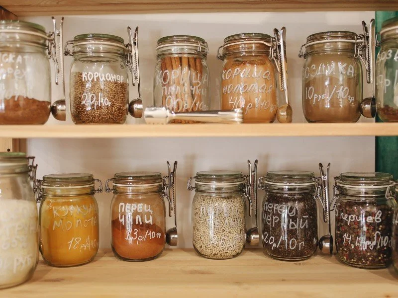 Pantry jars, neat ingredient organization.