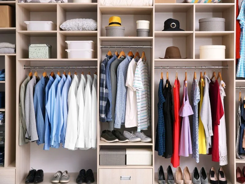 Color-coordinated wardrobe, maximized closet space.