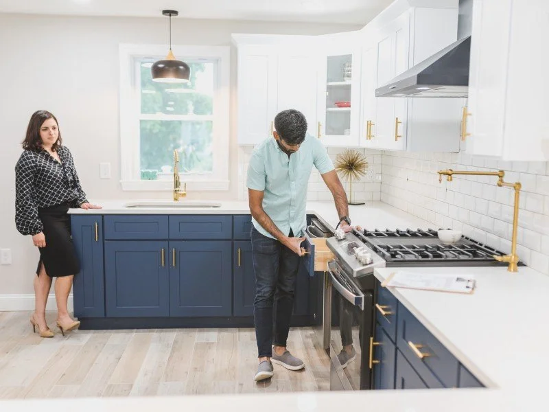 Cleaning kitchen stove with care.