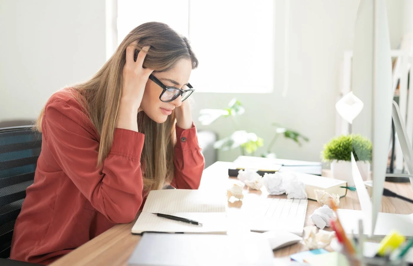 Stressed woman at desk dream space