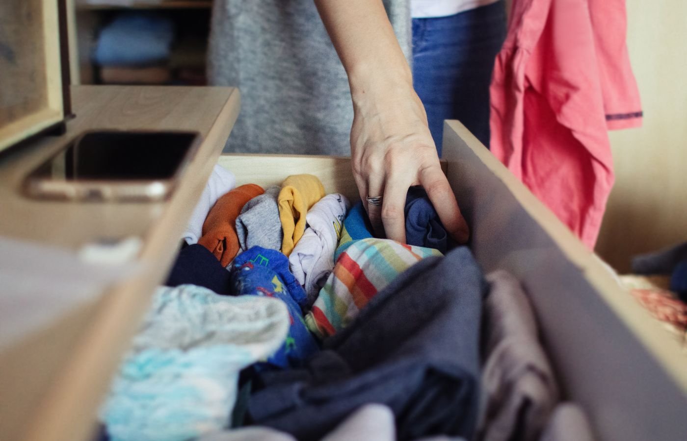 Sorting clothes in a drawer