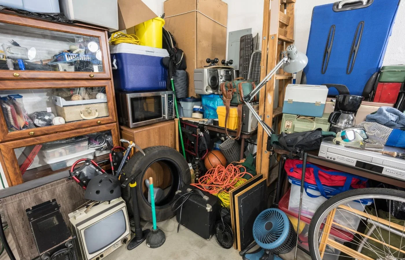 Overstuffed storage area with clutter.