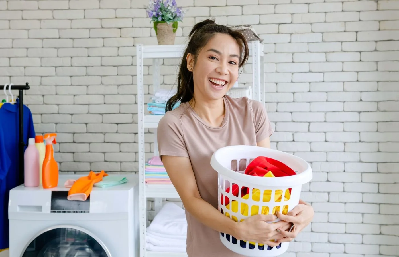 Effective Chore Charts Smiling woman holding laundry basket.