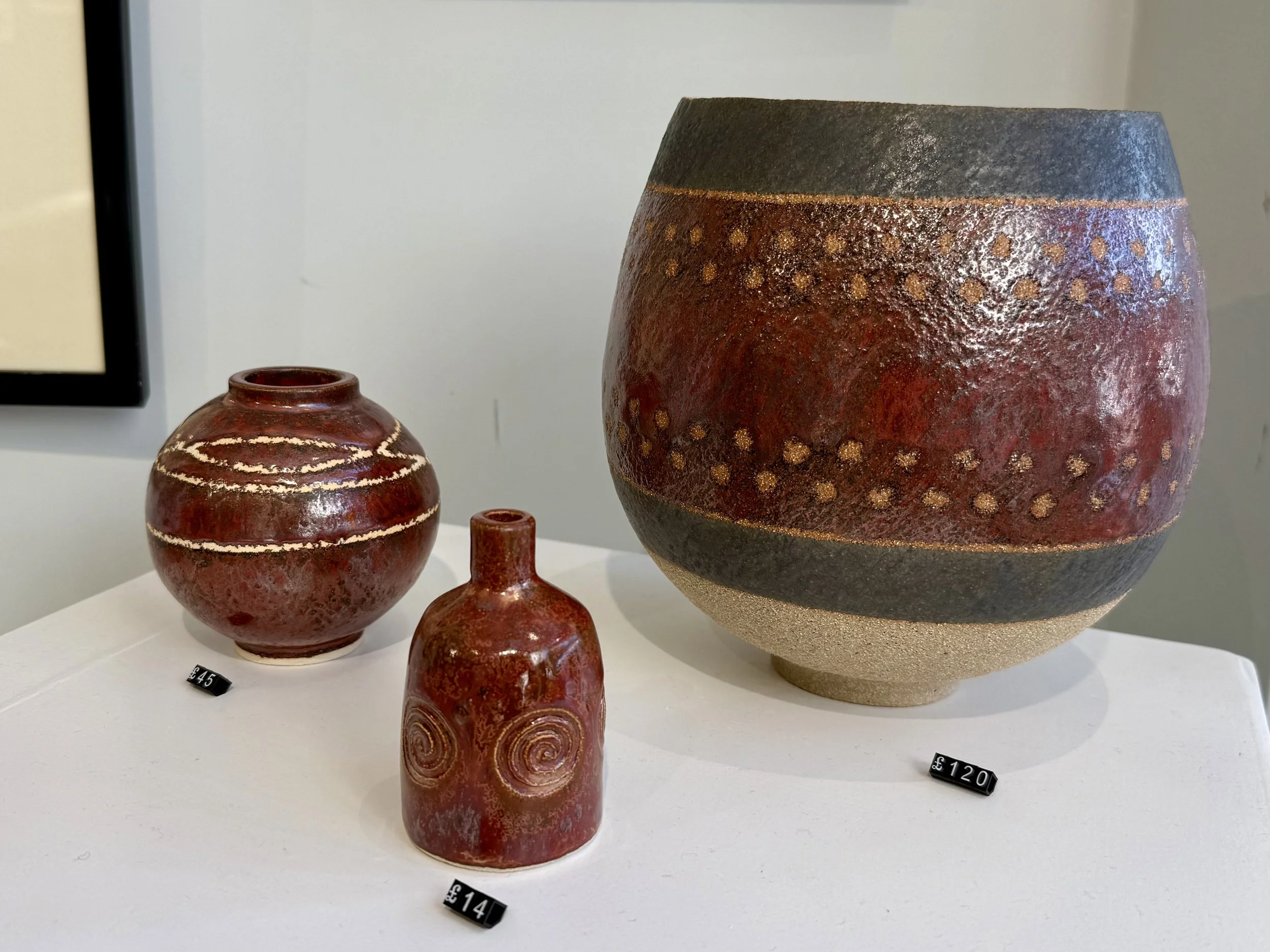 Ancient copper vessels.  Large pot £120, small moon jar £45, small bottle £14.