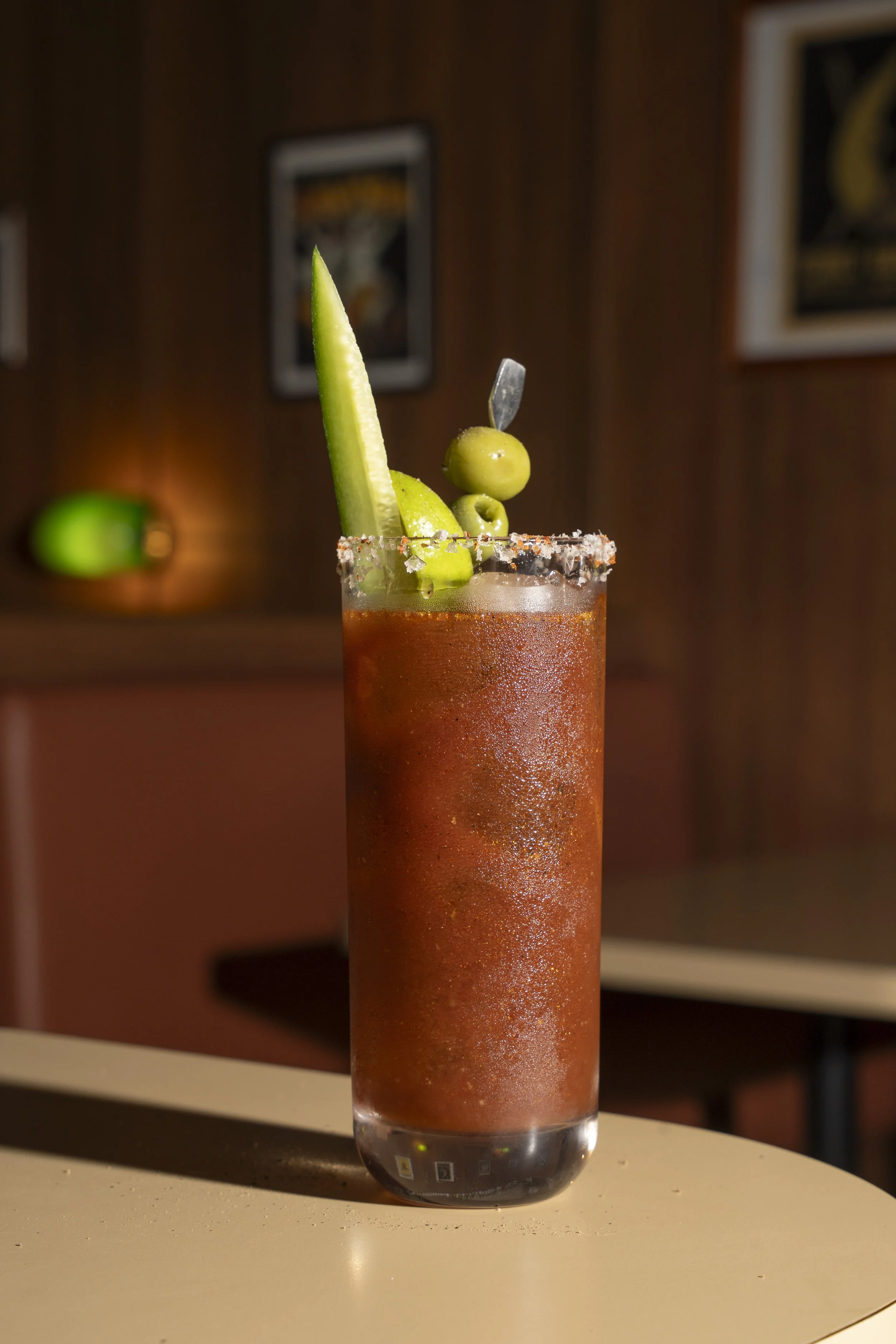Bloody Mary cocktail with celery, lime, and olive garnish.Gold Coast | Byron Bay Food Photography by Joey Bailey