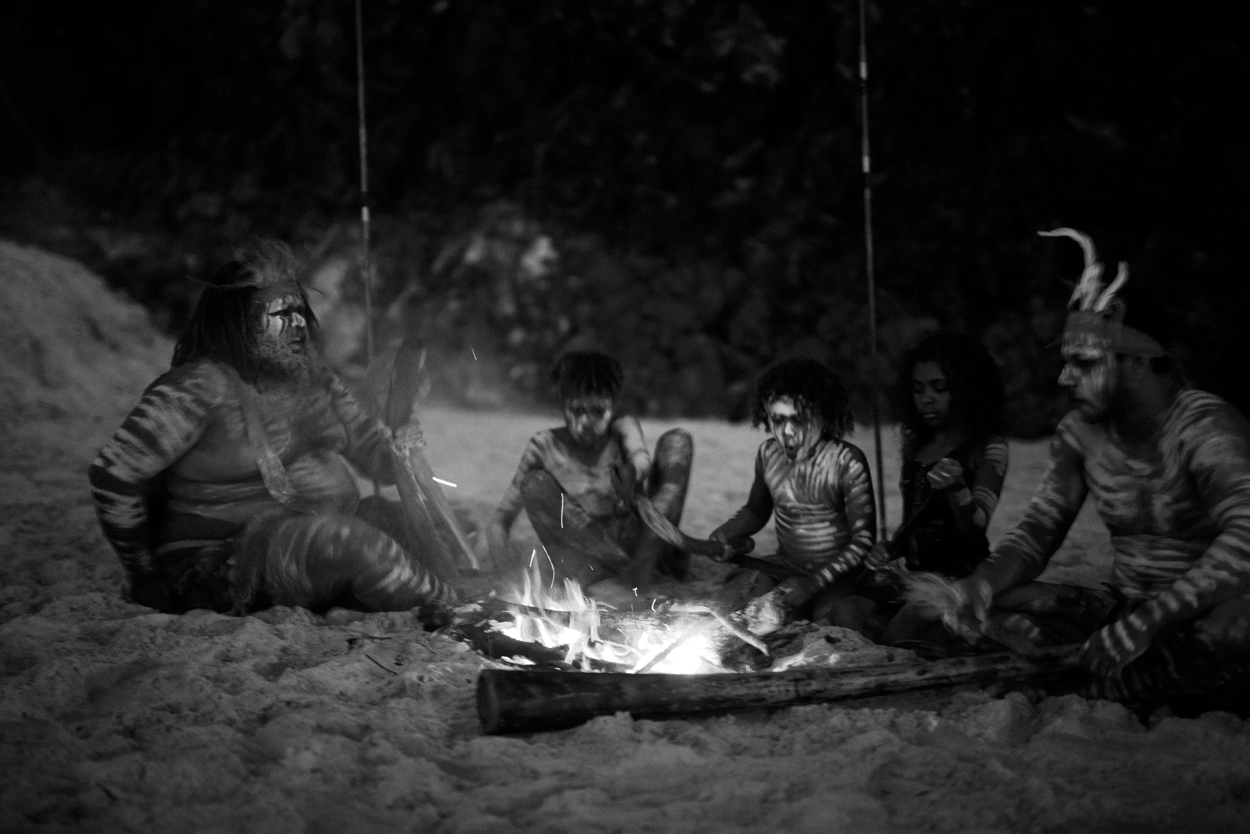 Indigenous Australians fire at Dreamtime beach during dusk . Gold Coast | Byron Bay Photography by Joey Bailey