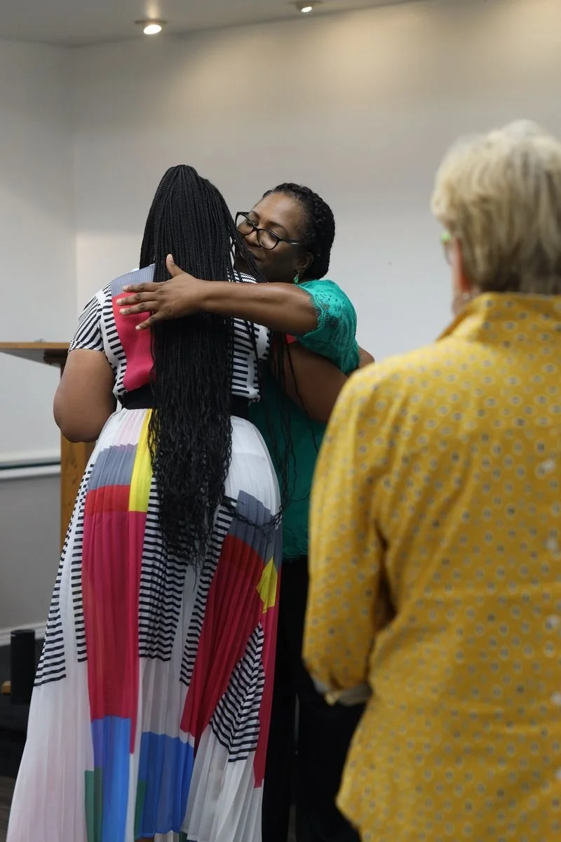 Minister Felicia hug Jamie.jpeg