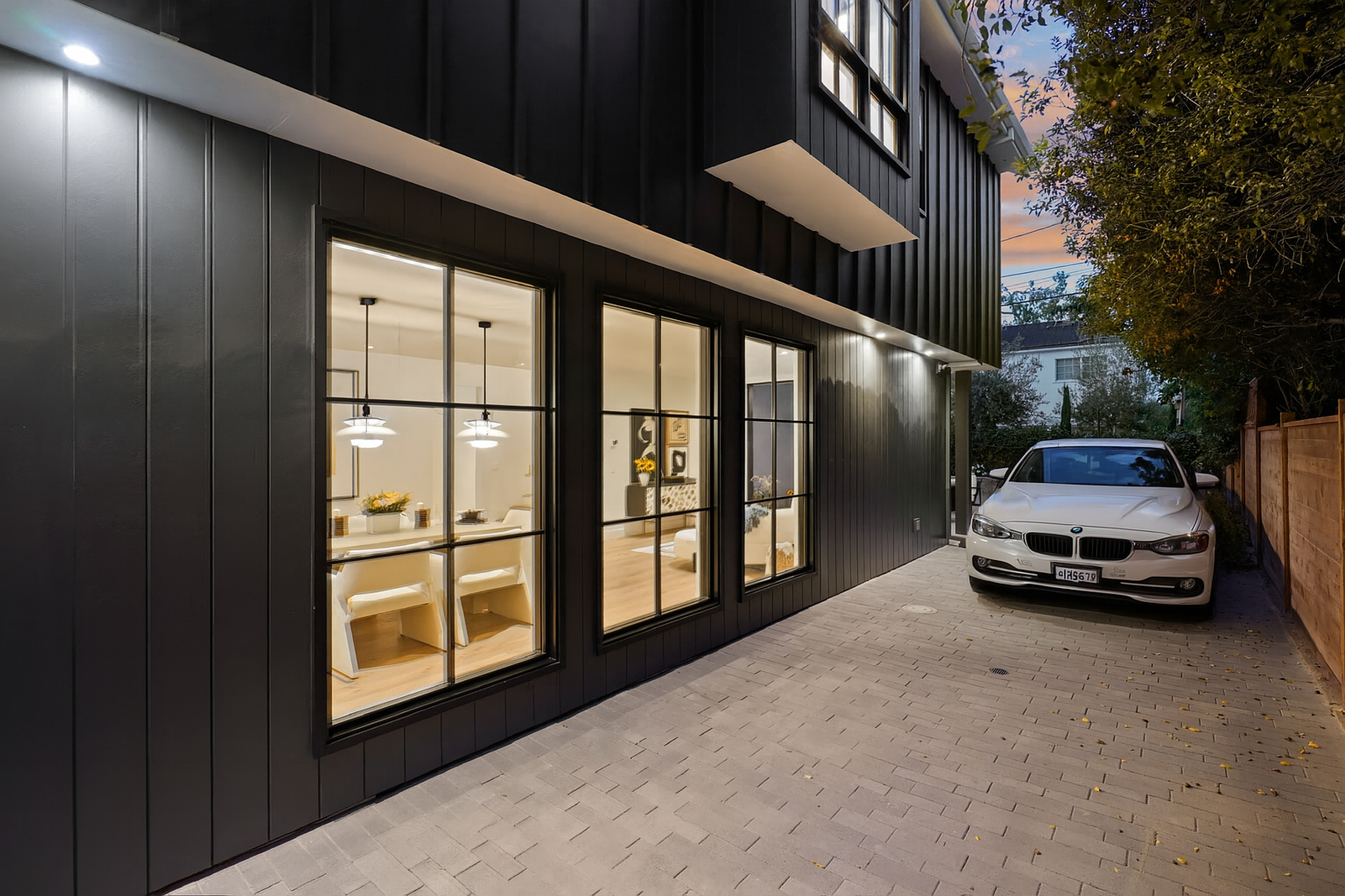 The permeable pavers along the driveway complement the views from inside to outside.
