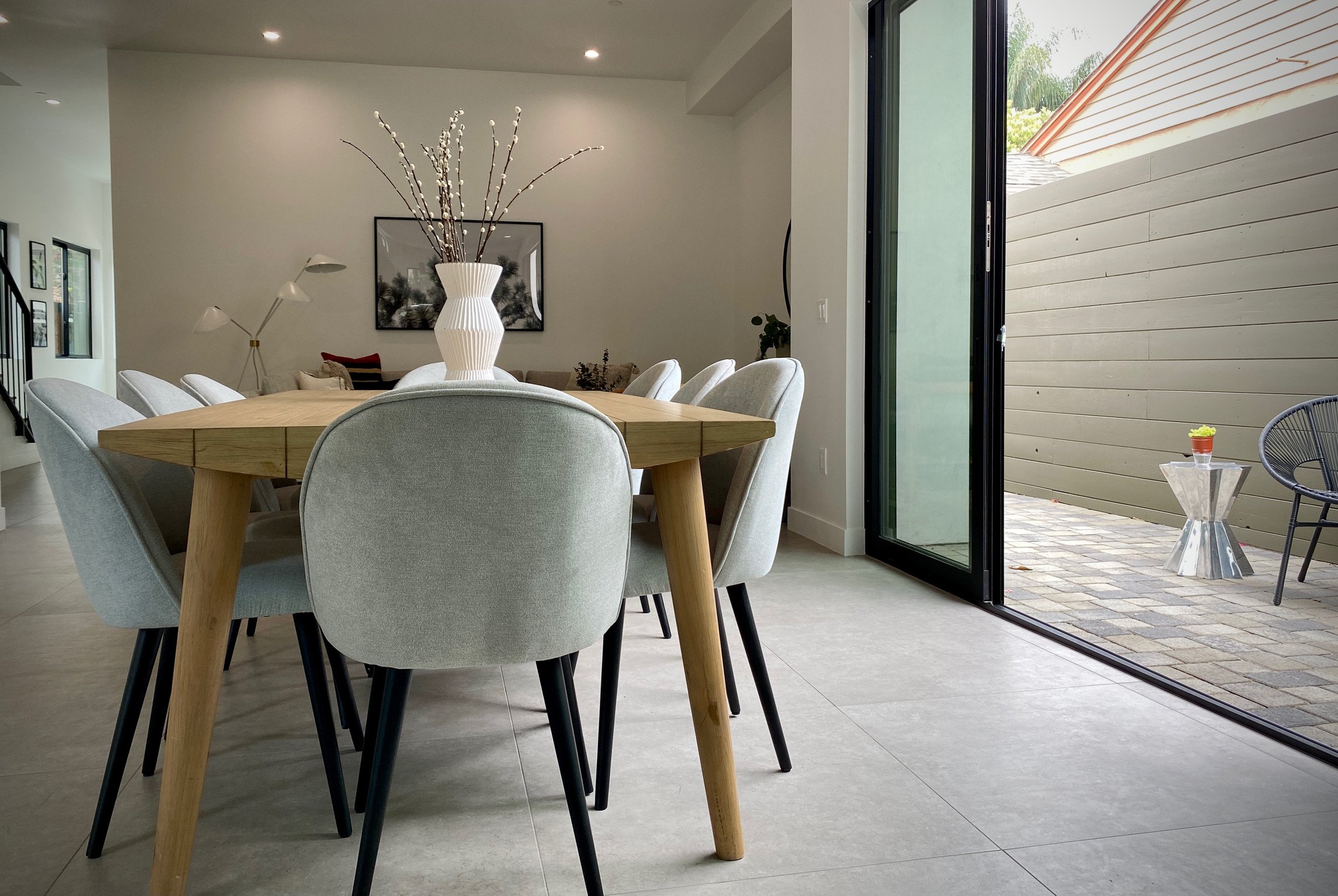 Large sliders next to the dining room allow for more open feel.