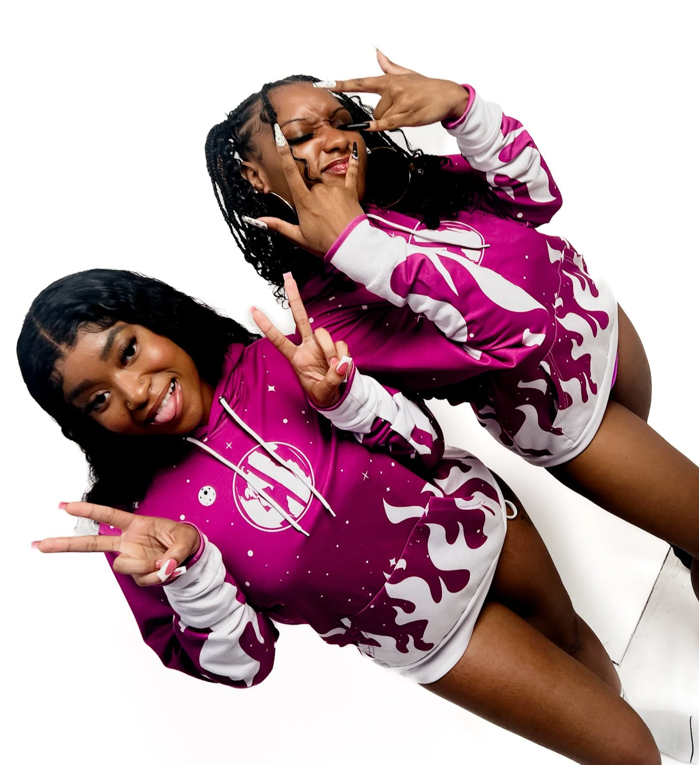 Clothes in various colors hanging on a white clothing rack against an orange background.