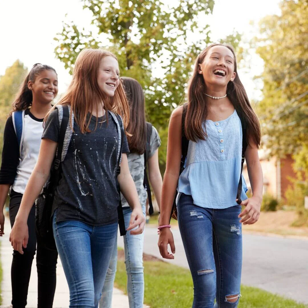 Group of teens laughing on a walk