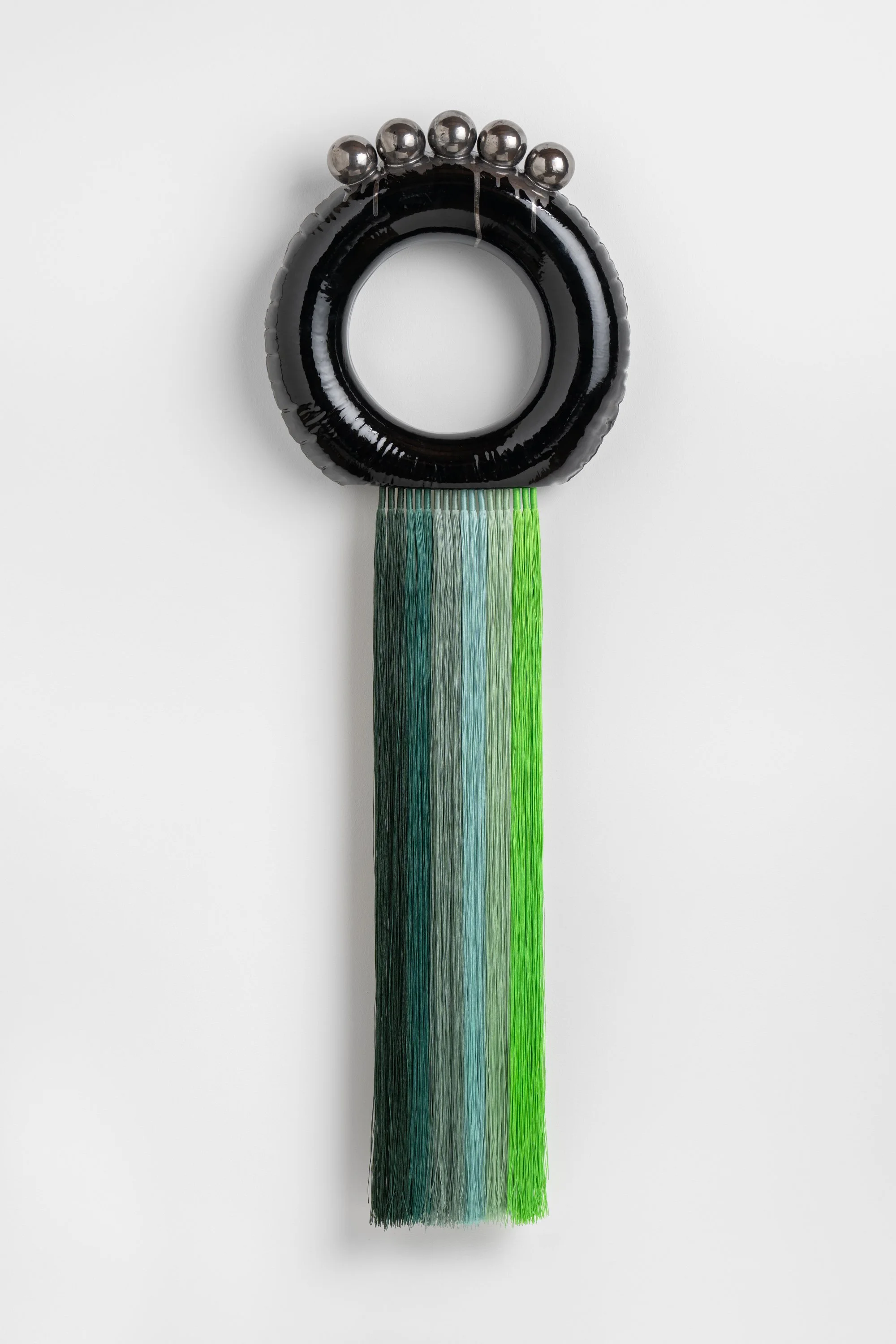 Colourless green dystopia, 2026. Porcelain, glaze, nylon cord, platinum lustre, epoxy. 105h x 39w x 10d cm. Image: Mark Pokorny
