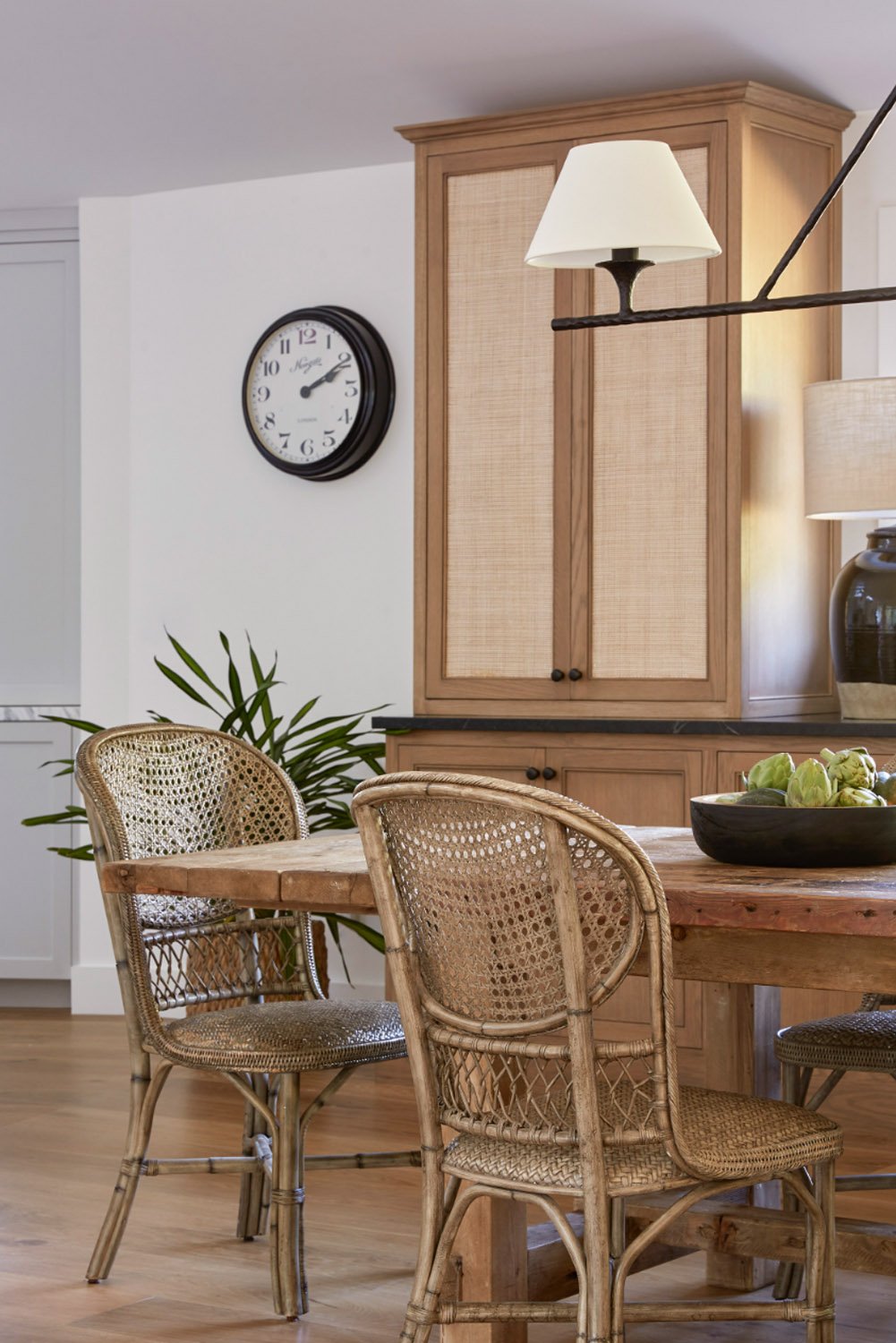 Rattan dining room chairs and cupboard.jpg