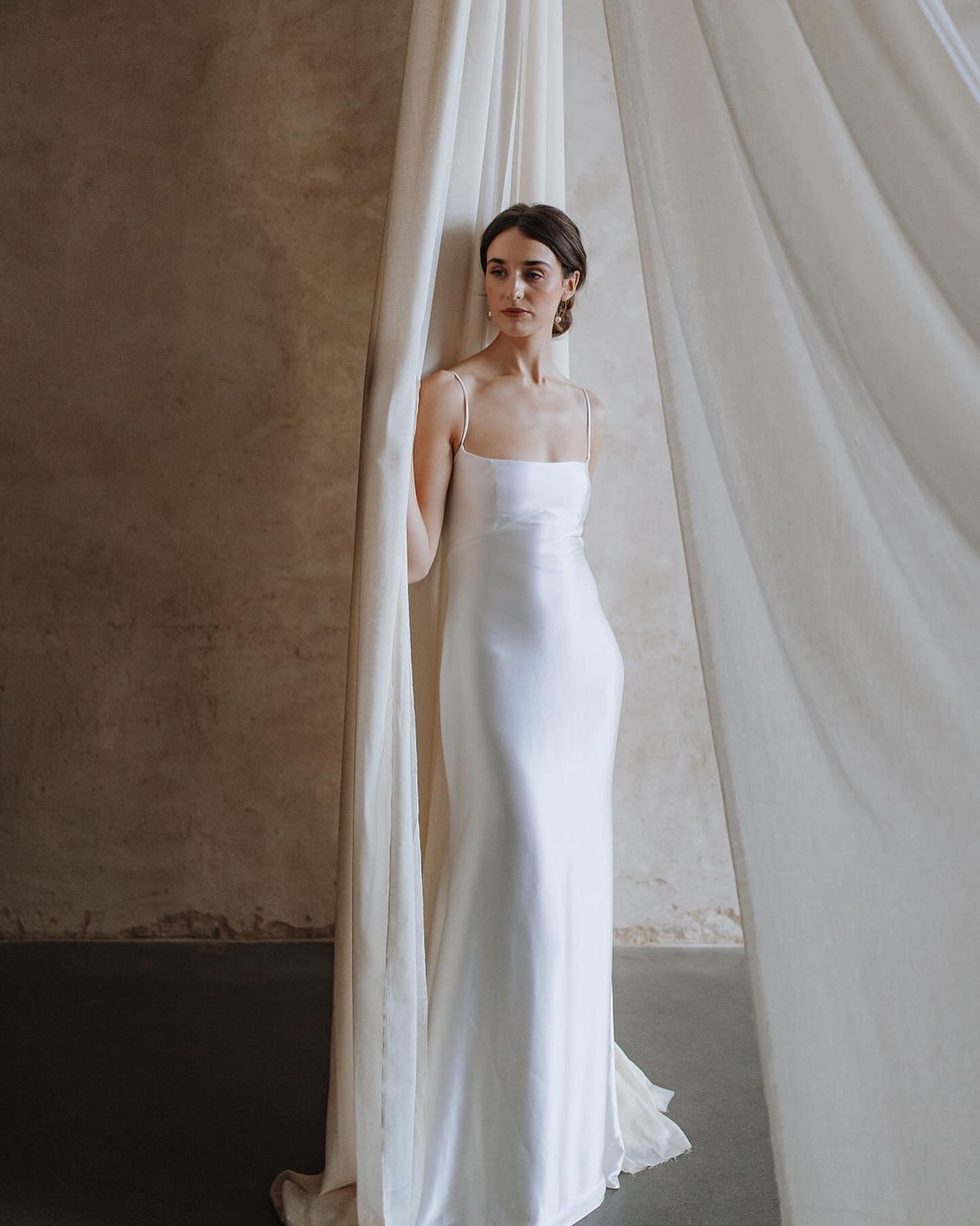 🖤 C O R A 🖤 

The epitome of sleek simplicity, Cora is the perfect base to build your bridal look upon. Choose to keep things minimalistic and modern letting this sumptuous fabric steal the show or add a bespoke design element to create an entirely