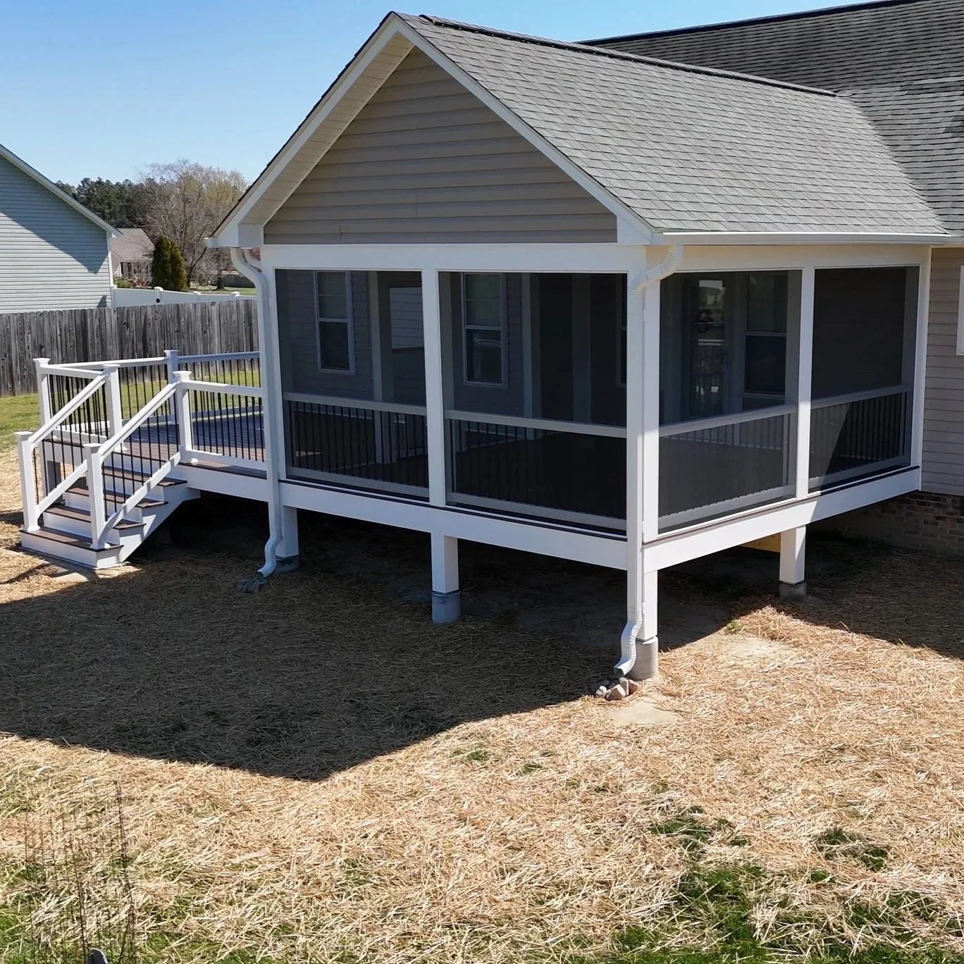 This 16 x 16 screen porch was completed in Zebulon, NC. Complete with painted pine ceiling, crown molding, ScreenEZE screen system, screen door with doggy door, vinyl rails with aluminum pickets, can lights and ceiling fan. The whole project was wrap